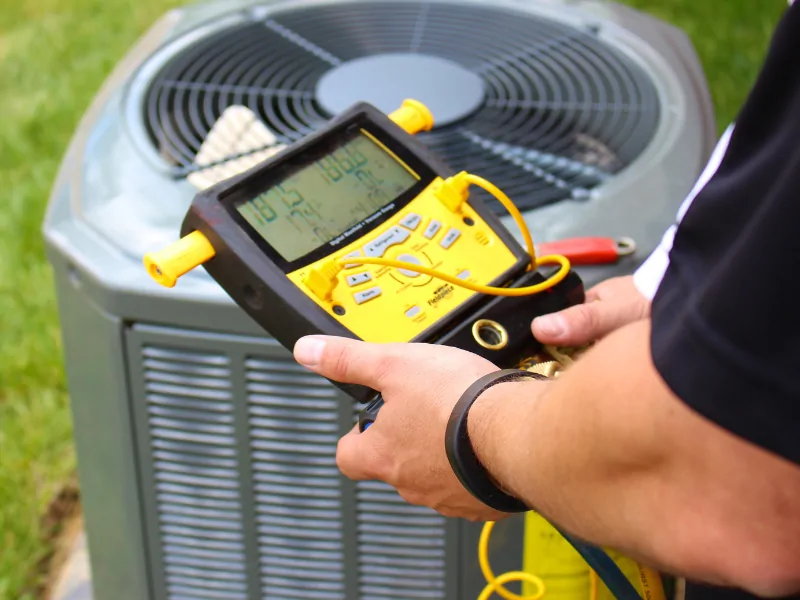HVAC technician working on equipment