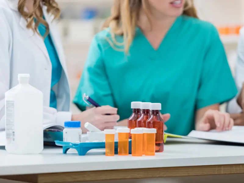 Pharmacy technician preparing medication